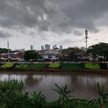 Big river on the edge of the settlement Stock Photos
