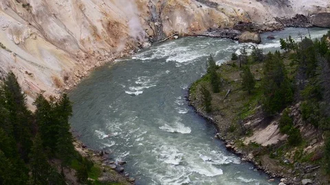 Big river going through a valley in Yellowstone Stock Footage 128205938
