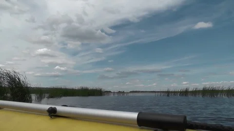 Big river to the horizon. Aboard of inflatable boat paddle in the foregroundе Stock Footage 71890759