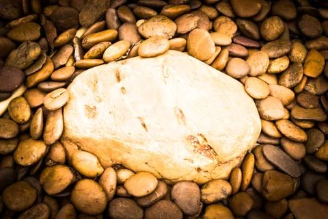 A big river stone on small river stone background Stock Photos