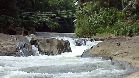Big river stream and some small waterfall on river valley Video stock 125464194