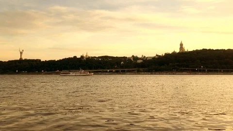 Big River In Sunset At Evening With Ship On Water And Child On Coast Stock Footage 91221922
