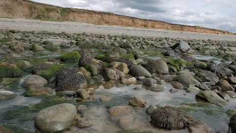 Big rock pools on British beach Stock Footage