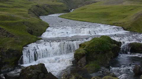 Big rock splitting step waterfall in Iceland Stock Footage 33747600