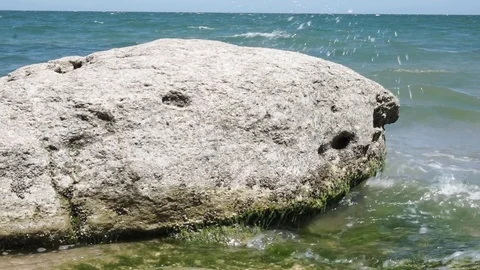 Big rock in the waterside Stock Footage 112889793