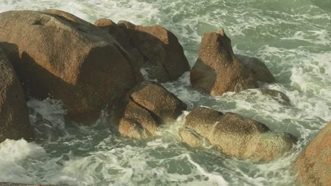 Big rocks and hitting waves Stock Footage 331008871