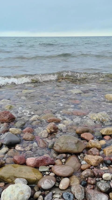 Big rocks on the seashore, waves in the sea Stock Footage 313728513