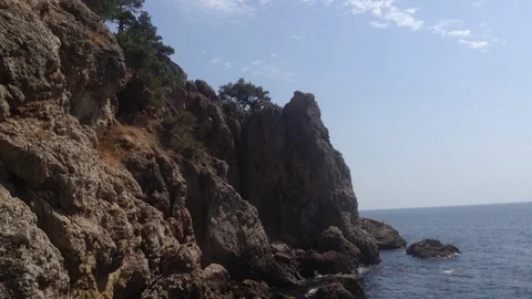 Big Rocks with Trees on Top In The Black Sea At Cape Aya Crimea Stock Footage 119688055