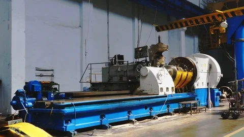 Big roll are created on the metal rolling machine at the plant. Creation of p Stock-Footage 118977574
