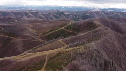 Big rolling mountain hills that have been burned Stock Footage 312042199