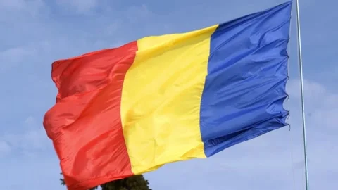 Big Romania Flag on post moving in the wind. Romanian red, yellow and blue flag  Stock Footage 164301747