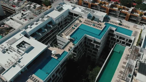 Big rooftop pools. Top view of the hotel in the resort town. Camera move down Stock Footage 168156079