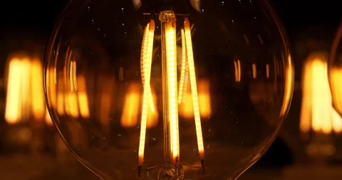 Big round light bulb with yellow filaments in retro style for lighting, decor Vídeo Stock 281009469