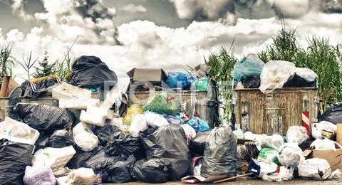 Big rubbish dump near the road. Disposal, deterioration and pollution concept Stock Photos