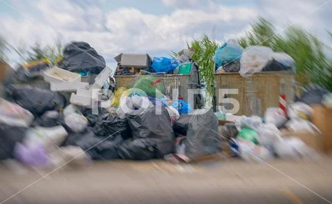 Big rubbish dump near the road. Disposal, deterioration and pollution concept Stock Photos