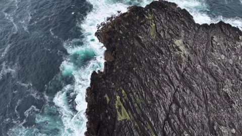 A big rugged cliffs washed by Atlantic Ocean, Ireland Stock Footage 342729047