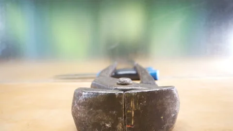 A big rusty pliers on top of the table Stock Footage 135697754