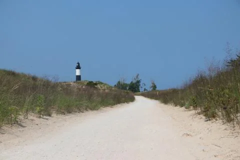 Big Sable Point Light viewed behind dunes near Ludington, Michigan Stock Photos