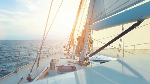 Big sailing yacht driving on the ocean on a sunny summer day - pov shot Stock Footage