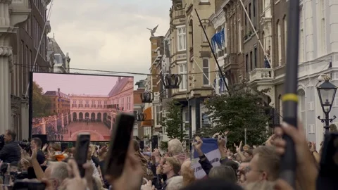 Big screen at Palace Noordeinde and crowd Prinsjesdag 17-09-2024 The Hague Stock Footage 309396148