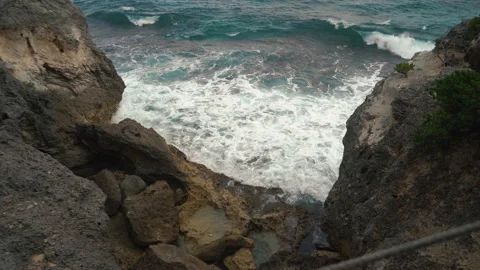Big sea waves break on rocks. stormy weather on ocean coast Stock Footage 169979462