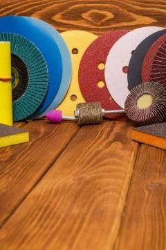 Big set of abrasive tools and multicolored sandpaper on wooden vintage backgr Stock Photos