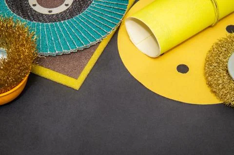 Big set of abrasive tools and yellow sandpaper on black background Stock Photos