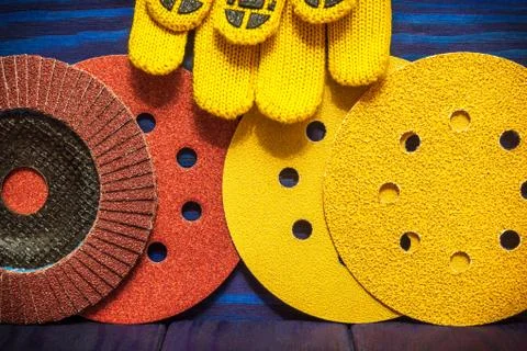 The big set of abrasive tools and yellow work gloves on blue vintage wooden Stock Photos
