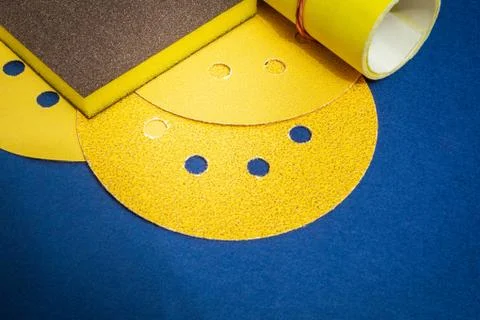 Big set of abrasive tools and multicolored sandpaper on blue background Stock Photos