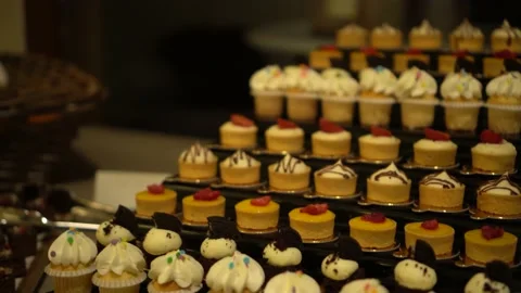 Big set of cupcakes on display Stock Footage 232757162