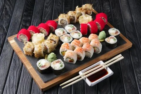 Big set of rolls served on stone plate. Layout for menu. Foto stock