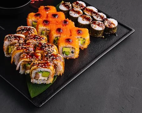 Big set of rolls on stone serving board Stock Photos