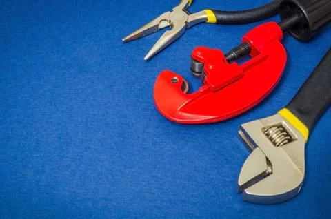 Big set of tools on blue background prepared by the master before repair or c Stock Photos