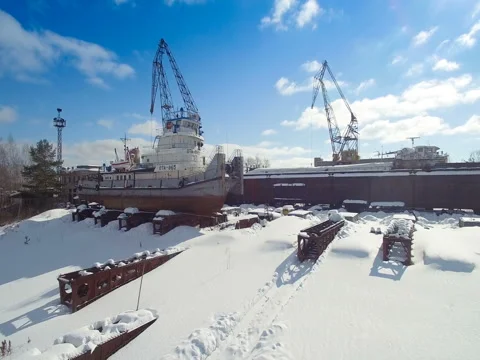Big ship with crane in the winter parking lot aerial view 스톡 동영상 74007969