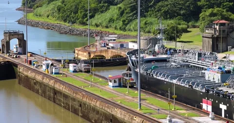 A big ship getting pulled through the Panama Canal Stock Footage 205279301