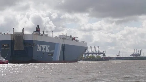 Big ship passes harbor Stock Footage 82383879