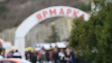 A big sign fair above the square with a crowd of people Stock Footage 67359092