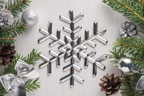 Big silver snowflake on white background Stock Photos