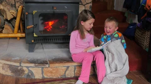 Big sister reading a book Stock Footage 61044042