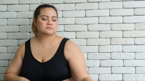 Big size or plus size girl show emotion of exercise is boring Video stock 120721162