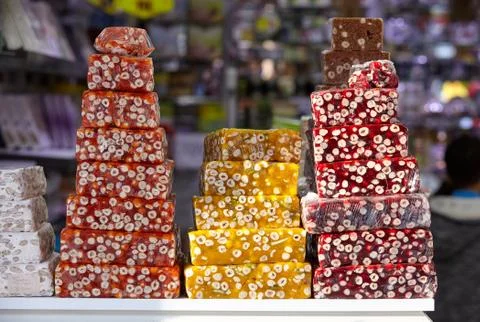 Big slices of Turkish delights with strawberry, orange and pomegranate taste  Stock Photos
