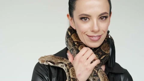 Big snake on a woman's neck. Stock Footage 148493996