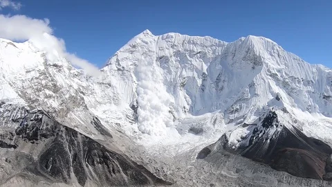 Big snow avalanche sliding down in the Himalaya, Nepal Stock Footage