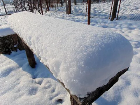 Big snow on a bench Foto stock