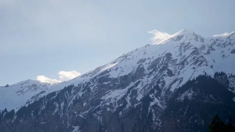 Big snowy mountain in the alps in winter, in Switzerland Stock Footage 239718537