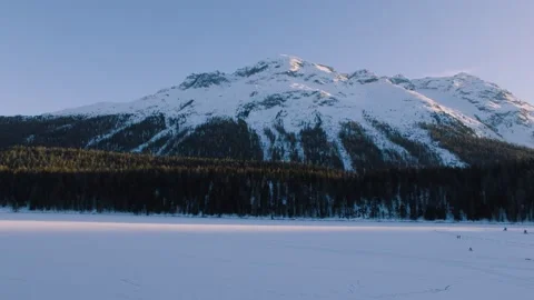 Big snowy mountain with forest in the valley - wide shot Stock Footage 161468389
