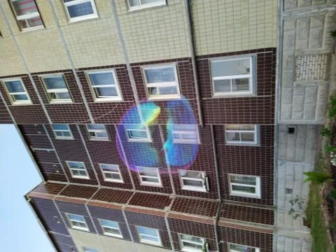 Big soap bubble on the background of a multi storey building Foto stock