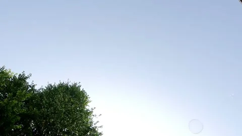 Big soap bubble being made and floating in the air then explode in slow motion Stock Footage 144419681