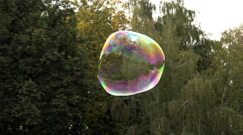 Big soap bubble flying and exploding - 4K Video stock 41756490