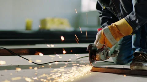 Big sparks in front of the camera creating by disc welding machine while some Stock Footage 170153279